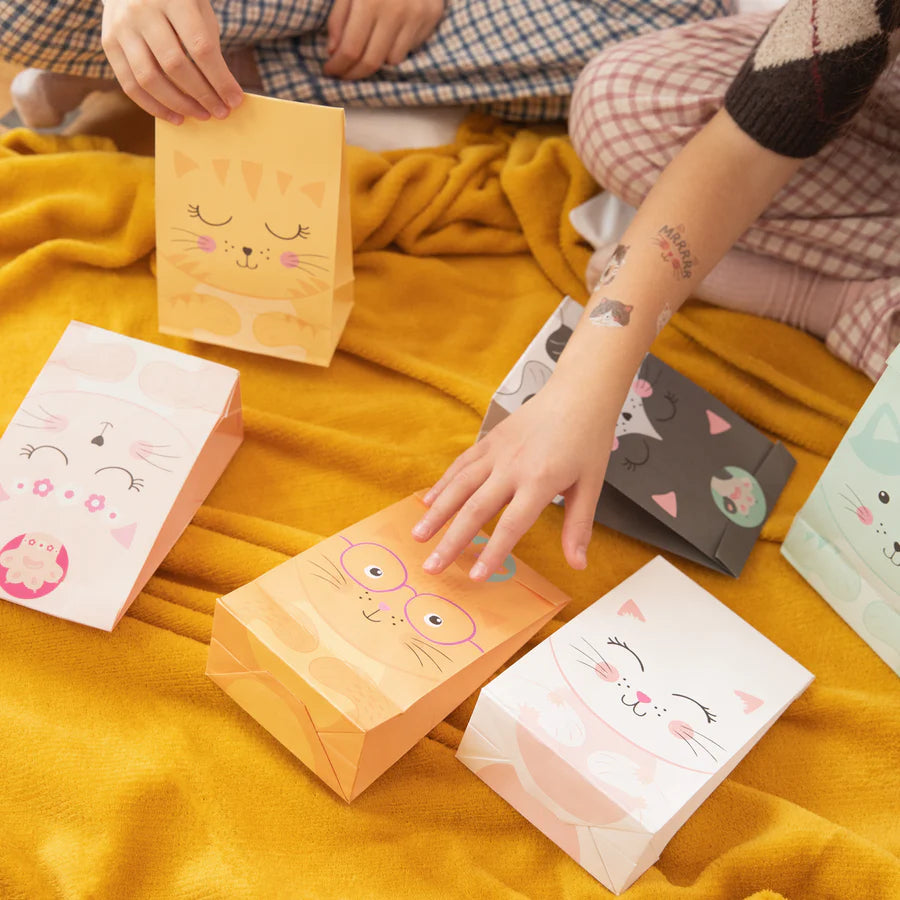 Colorful cat-themed treat bags on a yellow blanket, perfect for party favors or candy gifts. Set of 6 includes unique designs.