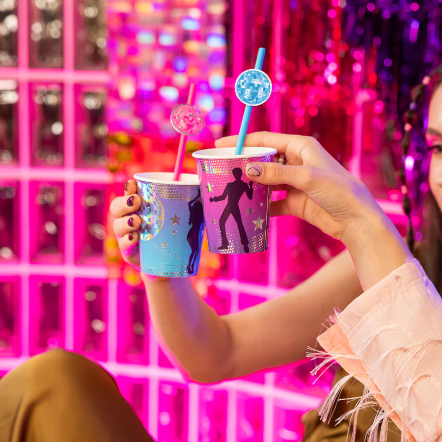 Colorful paper straws in retro disco-themed cups, perfect for parties, featuring vibrant colors and fun designs.