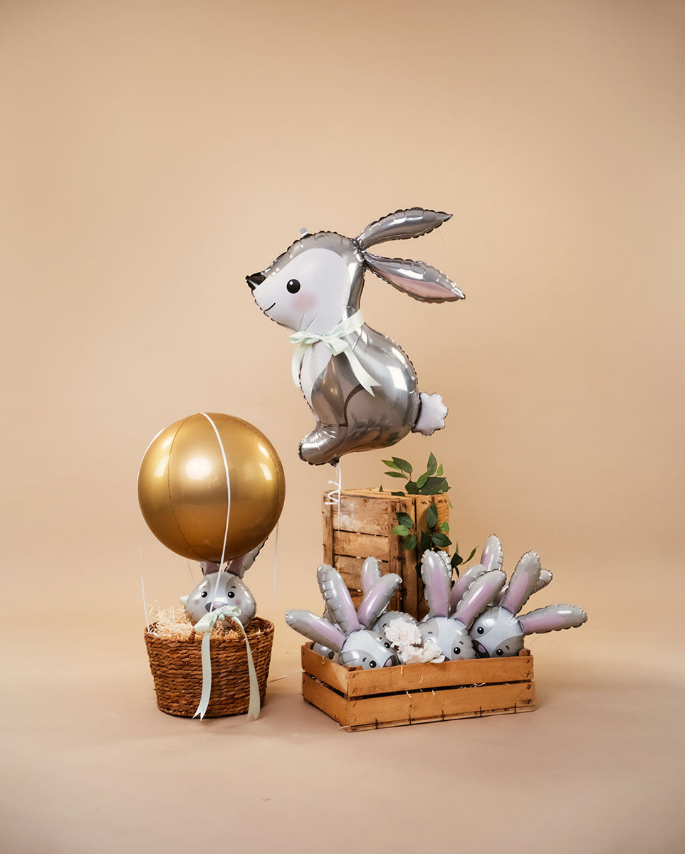 Foil Balloon Bunny, 79 cm, surrounded by decorative bunny balloons and a gold balloon, perfect for festive celebrations.